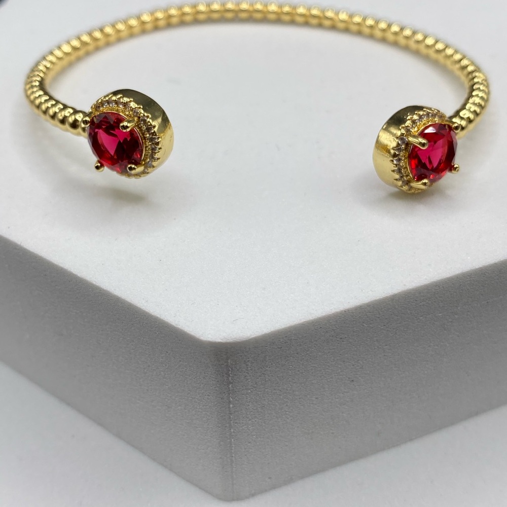 Elegant Gold Bracelet with Red Gemstones